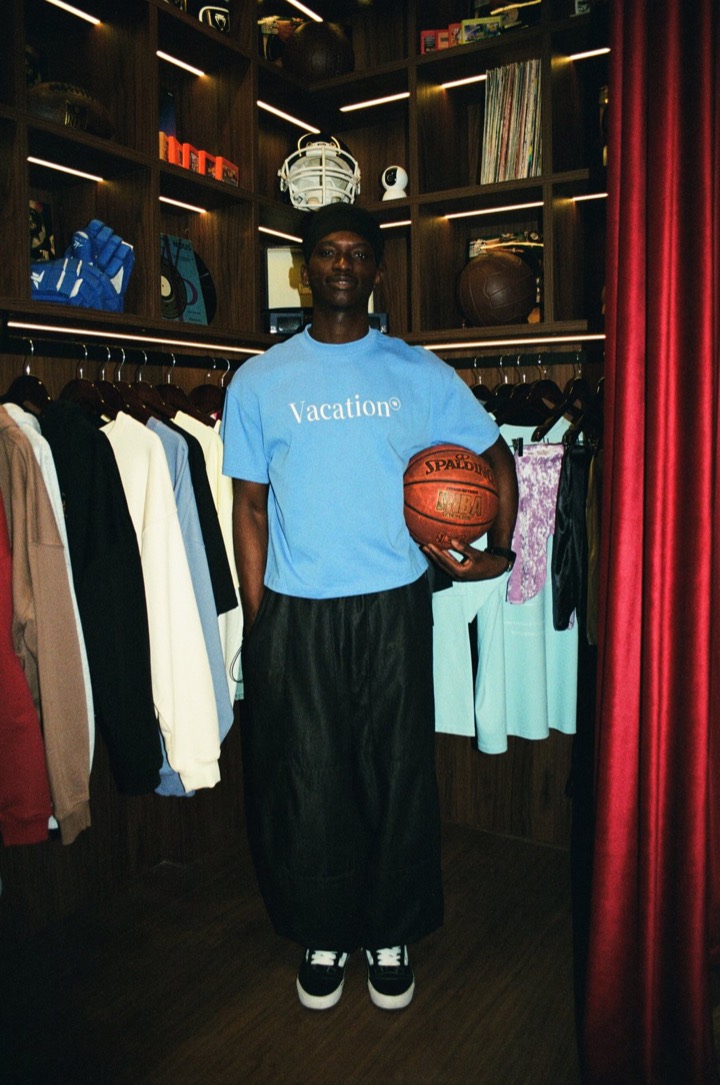 Deji full-length between clothing rails