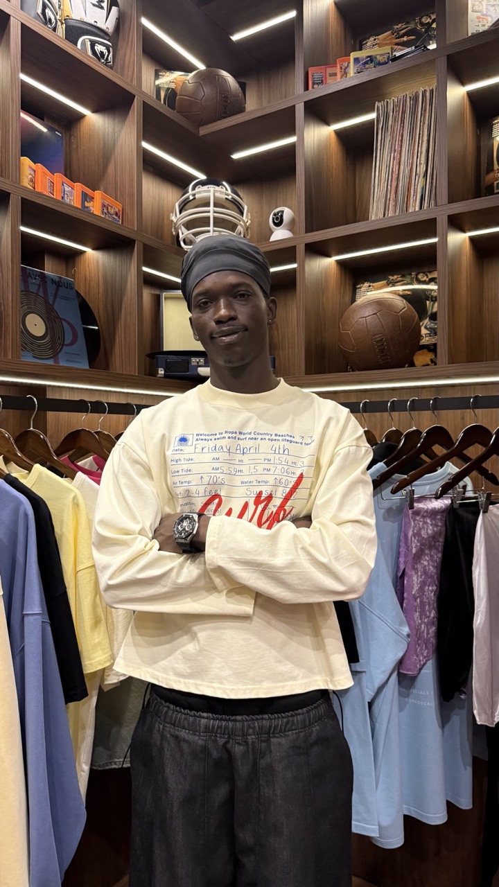 Deji in a cream graphic sweatshirt